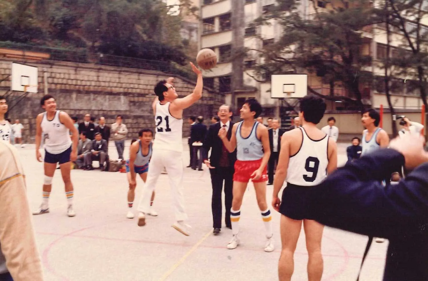 Dr. Cecil Chao enjoying a friendly basketball game with alumni and friends.