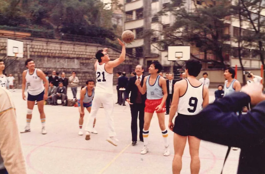 Dr. Cecil Chao enjoying a friendly basketball game with alumni and friends.