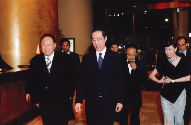 A photo of Dr. Cecil Chao with Mr. Henry Tang and friends.