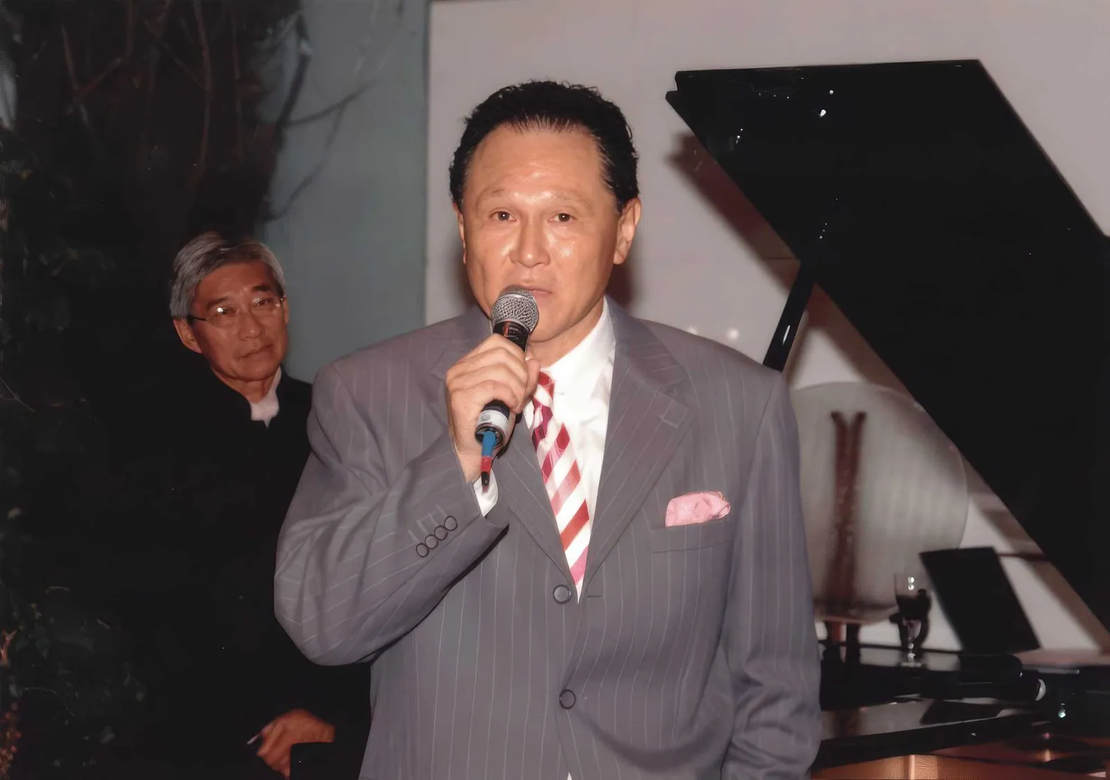 Dr. Cecil Chao giving a speech to his friends at an event.