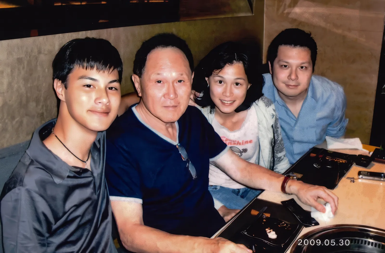 A photo of Dr. Cecil Chao with his children.