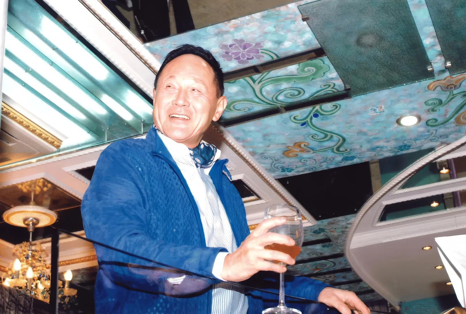 A portrait of Dr. Cecil Chao at his home during an event.