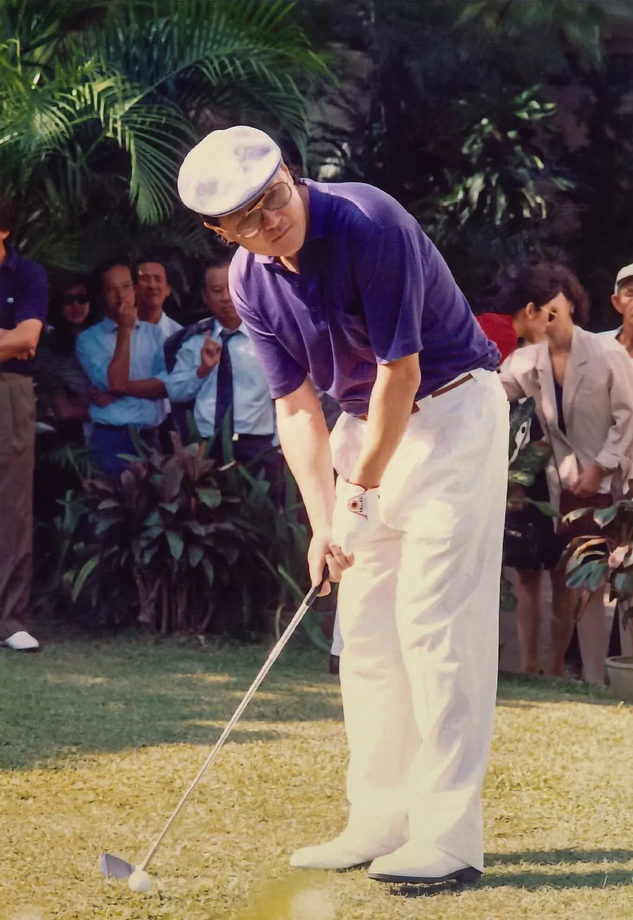 Dr. Cecil Chao competing in a golf tournament.