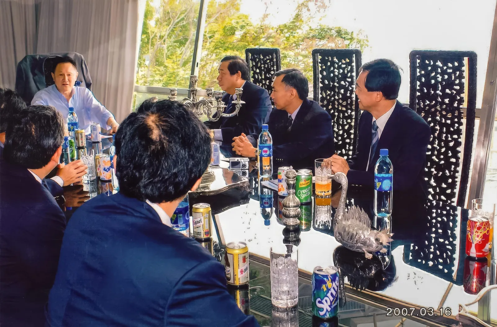 Dr. Cecil Chao disucssing project details with a group of colleagues.