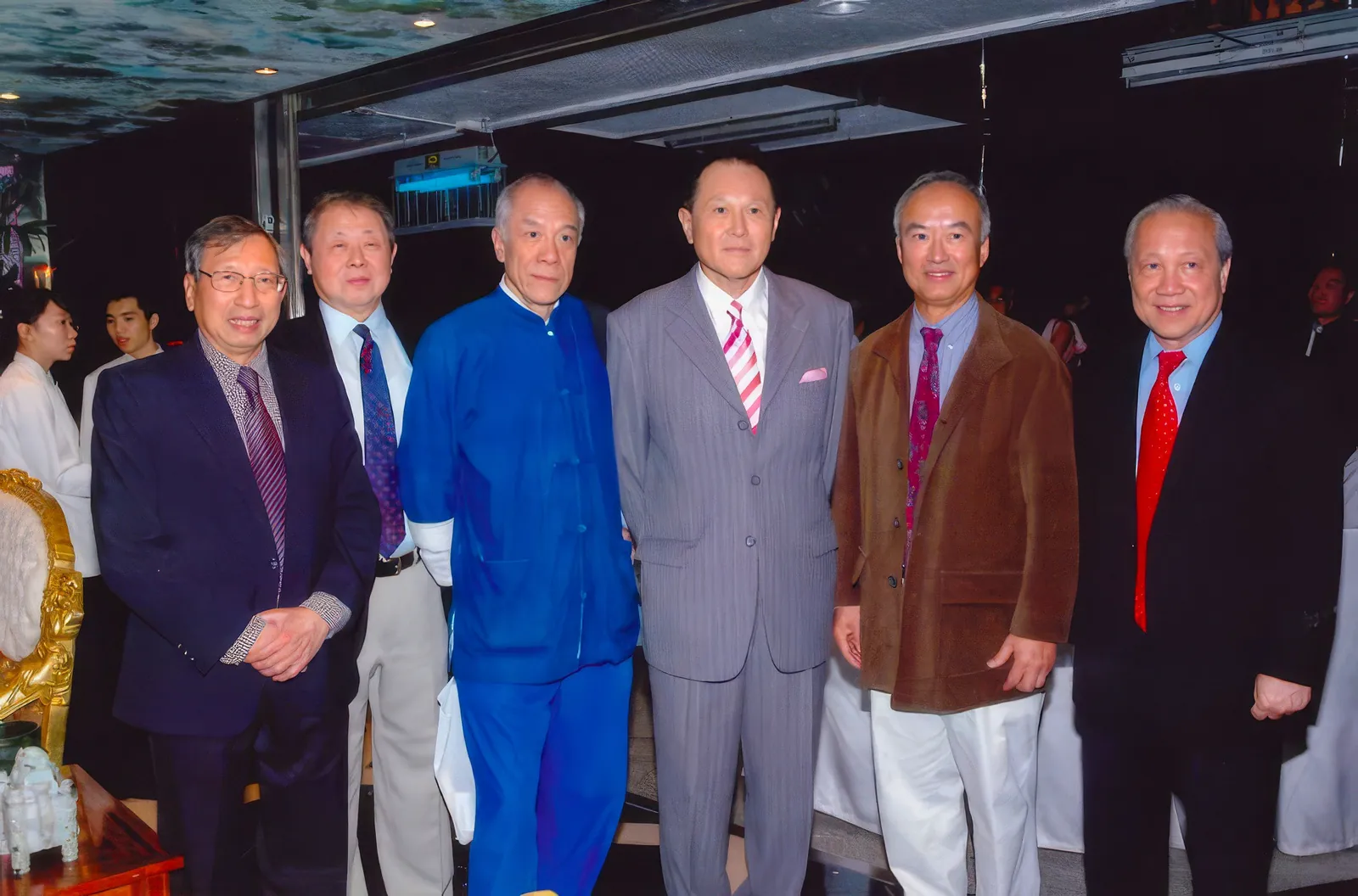 A group photo of Dr. Cecil Chao and his friends attending an event.