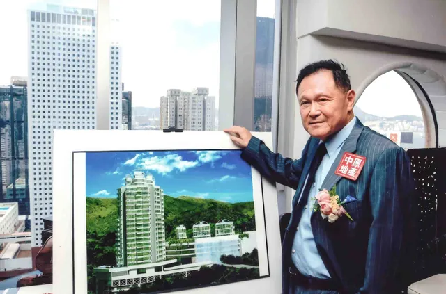 Dr. Cecil Chao presenting a photo of One Kowloon Peak at an event.